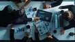 © InfiniteFlow - Top down aerial view of smart project manager present growth graph while marketing team analyze chart at meeting table with.laptop, tablet and stock market financial statistic document. Directorate.