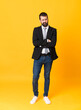 © luismolinero - Full-length shot of business man over isolated yellow background feeling upset