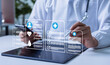 © Father_Studio - Doctor working on a tablet using a healthcare management system, representing secure medical data technology, efficient patient information management, and modern digital healthcare solutions.