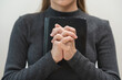 © KMPZZZ - Religion and believe, faith christian woman holding holy bible book in hand, peace and hope of humble. Pray, prayer person meditating, praying to request God, jesus asking for help, spiritual concept.