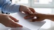 © ArtFocus Studio - Close-up of a teacher guiding the hand of a visually impaired person reading Braille text on paper, highlighting inclusive education, tactile learning, and accessibility support.