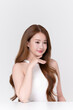 © Areerat - Clean beauty portrait of young Asian woman with brunette hair natural glowing skin, or advertise skincare product, wellness, self care and cosmetics concept.