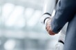 © Firadoaw - businessman shaking hands with humanoid robot in modern office environment symbolizing future business collaboration