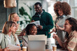 © Zamrznuti tonovi - Diverse business team collaborating during office meeting