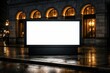 © Viktoryia - blank illuminated outdoor billboard mockup at night on wet rainy sidewalk, glowing copyspace display against luxury stone building with arched windows, concept of advertising, marketing, urban