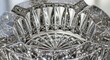 © Platon - Extreme close-up of a luxury cut-glass crystal ashtray showing intricate diamond patterns and light refraction.