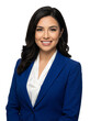 © Beach Lover - Professional businesswoman smiling confidently in a blue suit against a white background, representing success and corporate attire.