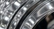 © Marmi - Close-up macro of chrome surface texture with dynamic light reflections, abstract metallic background featuring high gloss finish and sleek modern aesthetic.