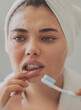 © sebra - Young woman looking at her red bleeding gums