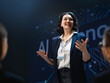 © Konstantin Yuganov - Confident Female Speaker Presents at AI Technology Conference to