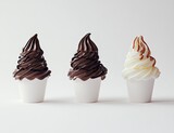 Trio of cups with flavors: Three cups of soft‑serve ice cream—two chocolate and one vanilla with caramel drizzle—arranged neatly
