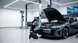 © Artem Zatsepilin - caucasian female mechanic using tablet to diagnose electric car with open hood in modern auto repair shop. vehicle maintenance service concept. banner, website header with copyspace.