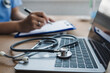 © Icon Universe - Stethoscope on Laptop Keyboard in Medical Office