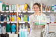 © JackF - Positive young female customer choosing present in cosmetic department of retail store