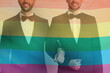 © New Africa - Happy gay couple in elegant suits standing near white wall, double exposure with pride flag