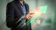 © Sana - Businessman touching upward arrow growth interface, performance improvement and revenue increase concept, digital strategy development, success planning, financial growth trend visualization