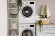 © Pixel-Shot - Laundry room with washing machines and white counters