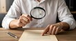 © Halal Store - Person using magnifying glass to examine document with white shirt
