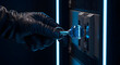 © adi - A gloved hand inserting a key into a secure server rack lock, symbolizing unauthorized access and critical data protection challenges in modern cybersecurity