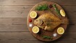 © Soba - Whole baked flounder with lemon rosemary and spices on wooden board for seafood background and rustic dinner presentation