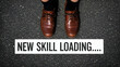 © VectorGenius - Man wearing brown shoes standing on asphalt with skill loading sign