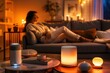 © Evon J - Cozy living room with warm ambient candlelight and smart diffuser for relaxation background and interior decor banner
