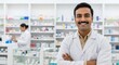 © PRASANNAPIX - young indian professional pharmacist standing in a pharmacy surrounded by medicines