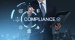 © ImageFlow - Business professional using futuristic compliance interface with