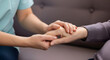 © Evando Zhafran - Caring hands offering comfort and support to an elderly person, symbolizing compassion and empathy in healthcare or home care settings