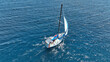 © aerial-drone - Aerial drone photo of small sail boat cruising deep blue Mediterranean Sea