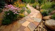 © alap - Winding garden pathway constructed with multicolored natural flagstones bordered by abundant perennial flowers