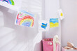 © New Africa - Toys and beautiful drawings in stylish child's room, closeup