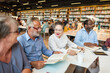 © Rawpixel.com - Diverse group reading together.