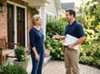 © irawan - Homeowner talking with pest control professional holding clipboard, consultation concept, friendly interaction