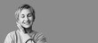 © Pixel-Shot - Black and white portrait of beautiful happy mature woman with short hair. Banner for design