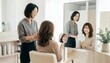© Yka - 美容室で鏡越しに仕上がりを確認し笑顔で会話する女性客と女性美容師