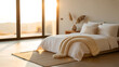 © Nazmul Karim Sakib - Luxurious master bedroom with a white bed and knitted throw blanket facing a large glass window with a panoramic desert landscape view at sunset for high-end real estate and resort living