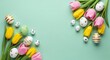 © rahul09 - A colorful Easter-themed arrangement of tulips and decorated eggs on a pastel green background