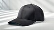 © Stockimage - Black baseball cap isolated on white and black background showing a simple blank headwear object