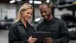 © FrameYesil - Technician woman showing engine status data on tablet to coworker, surrounded by cars, lifts, and well-lit garage interior. cinematic color correction, natural uneven lighting yet gentle backlight,