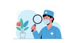 © Shoubj - Medical professional in blue scrubs using a magnifying glass to inspect a potted plant for scientific research.