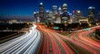 © Gen - Broad streams of white and crimson headlights race along converging expressways toward a dense skyline of glowing towers, capturing the relentless pulse of a modern metropolis as deep blue night settl