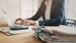 © sebra - Business person working laptop and documents