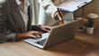© Prathankarnpap - Cropped shot of two businesspeople working together at office desk