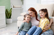 © New Africa - Mother and her daughters spending time together at home, space for text