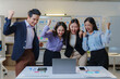 © Crystal - Business team cheering with raised fists, celebrating success and achievement in their modern office workspace