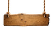 © Jn - Isolated rustic wooden sign hanging by thick ropes, blank wood plank for message
