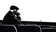 © lors of design - Silhouette of a man sitting alone in a row of empty seats looking down