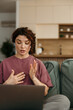 © La Famiglia - Woman explaining work tasks during remote video call