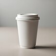 © Rayna - Empty white paper coffee cup with lid placed on a flat surface ready for hot beverages